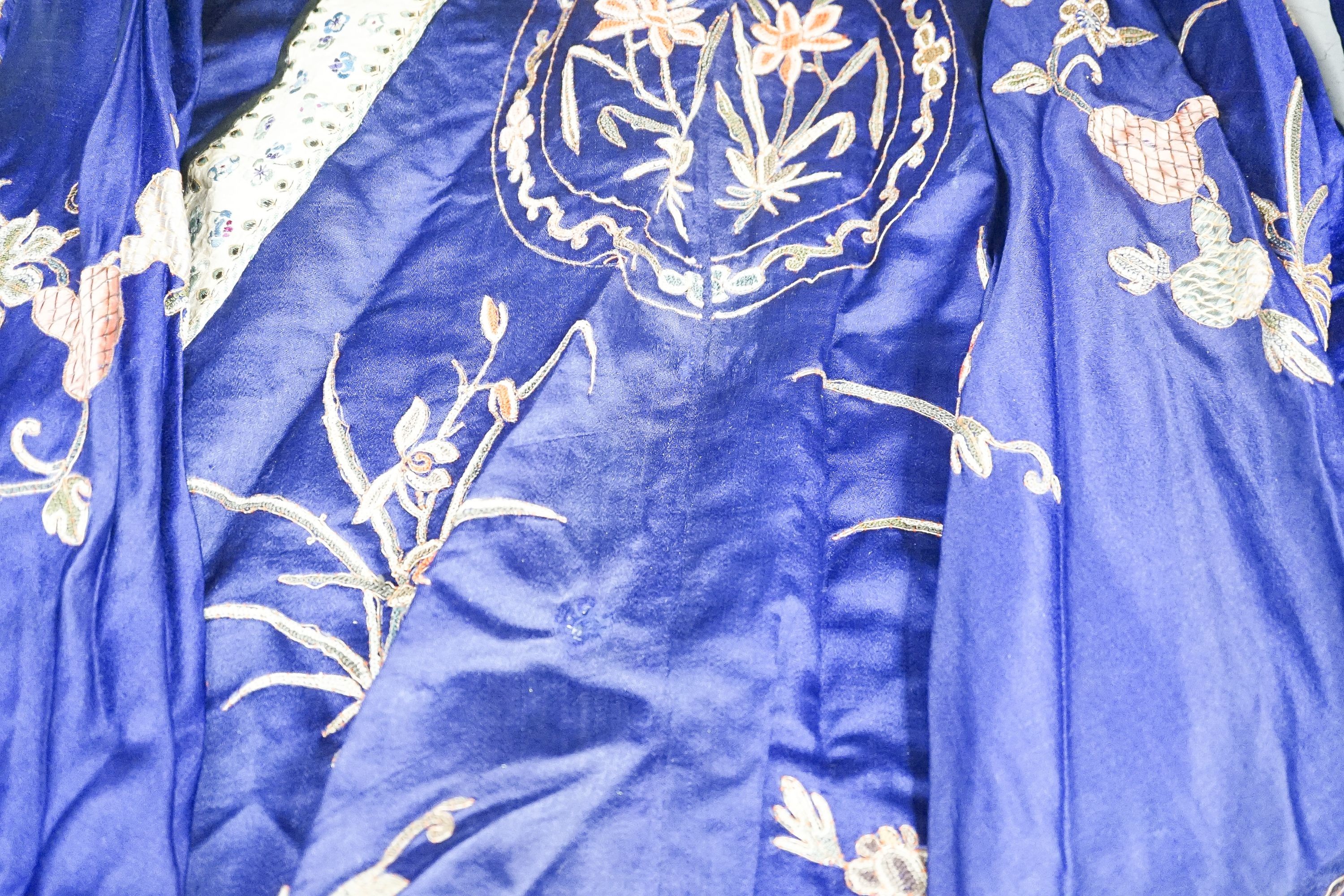 A Chinese embroidered silk robe and a matching pair of trousers